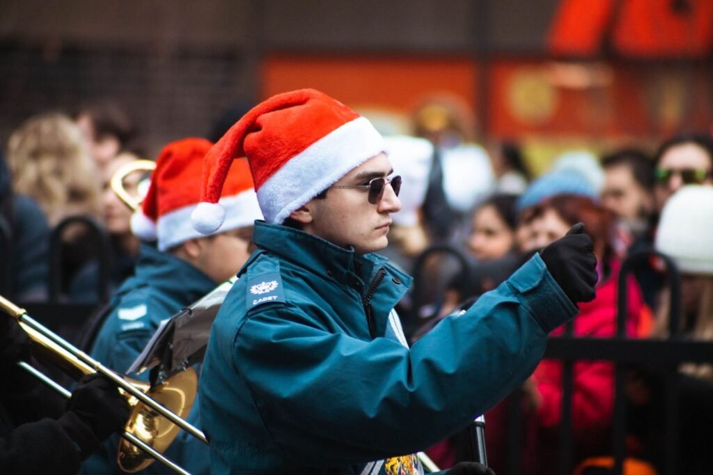 Band member in a Santa hat at a Christmas parade; a stand-in photo